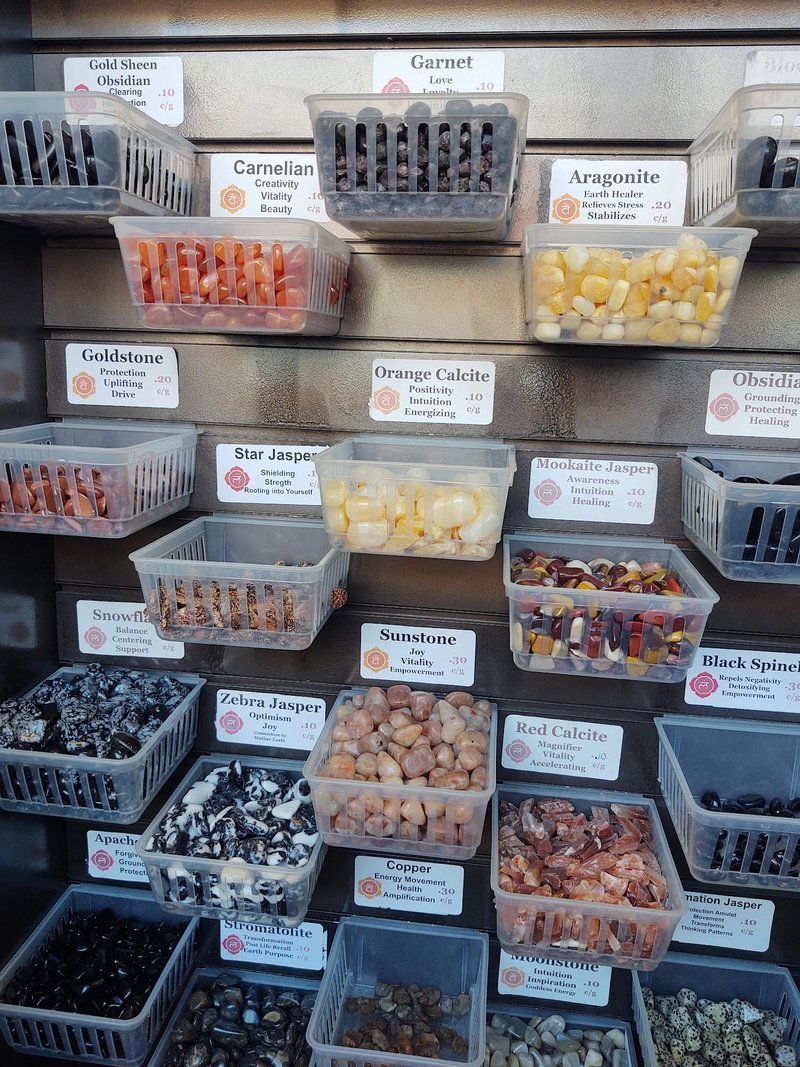 Array of minerals including jaspers, calcites, garnets, obsidians, and moonstones