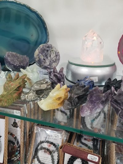 A Bead Source's display of crystal dragon head carvings and druse