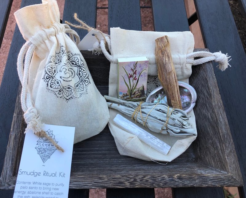 Smudge Ritual kit containing sage, palo santo, abalone shell, and selenite