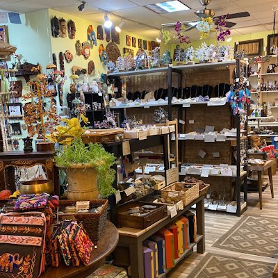 Interior showing bonsai crystal trees, artisanal bags and necklaces