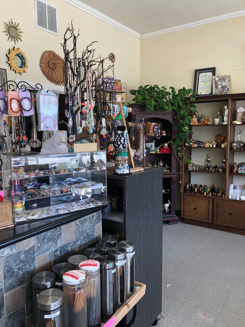 Shop interior featuring gemstones, healing crystals, and spiritual products