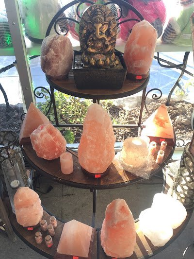 Display featuring crystal points, polished stones, and raw mineral specimens