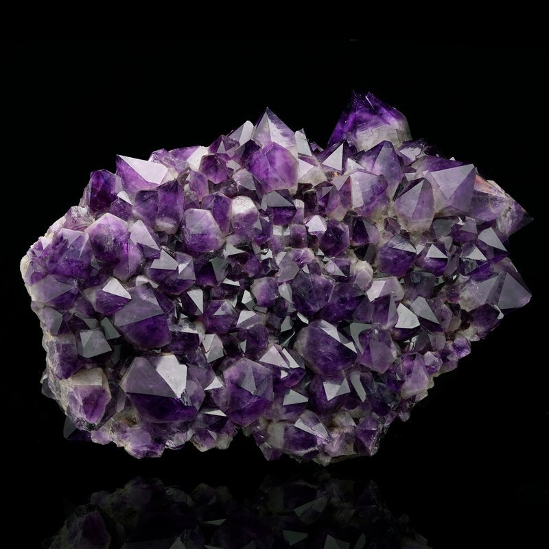 Display featuring crystal points, polished stones, and raw mineral specimens