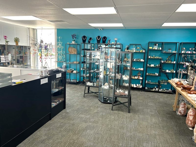 Shop interior featuring gemstones, healing crystals, and spiritual products