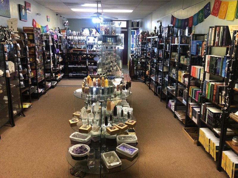 Shop interior featuring gemstones, healing crystals, and spiritual products
