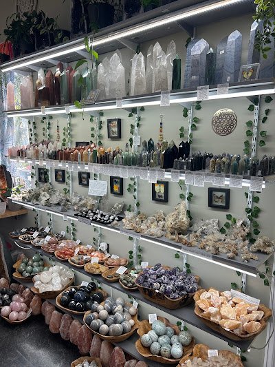 Shop interior featuring gemstones, healing crystals, and spiritual products