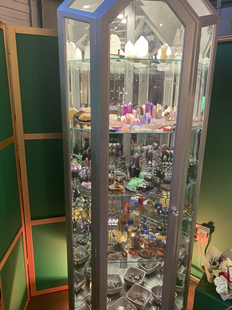 Shop interior featuring gemstones, healing crystals, and spiritual products
