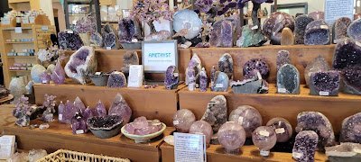 Wall display with decorative items and metaphysical supplies