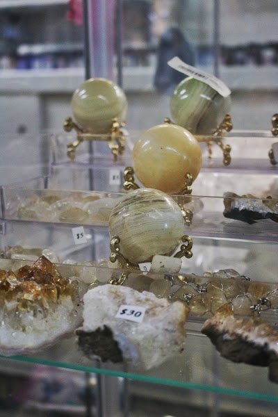 Crystal and mineral specimens including quartz, amethyst, and calcite varieties
