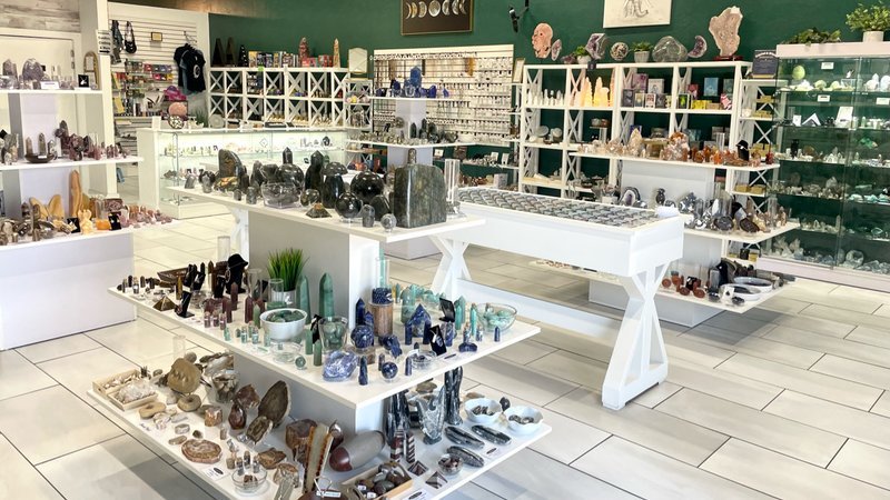 Shop interior featuring gemstones, healing crystals, and spiritual products