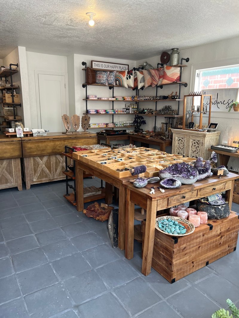 Collection of tumbled stones, raw minerals, and crystal clusters