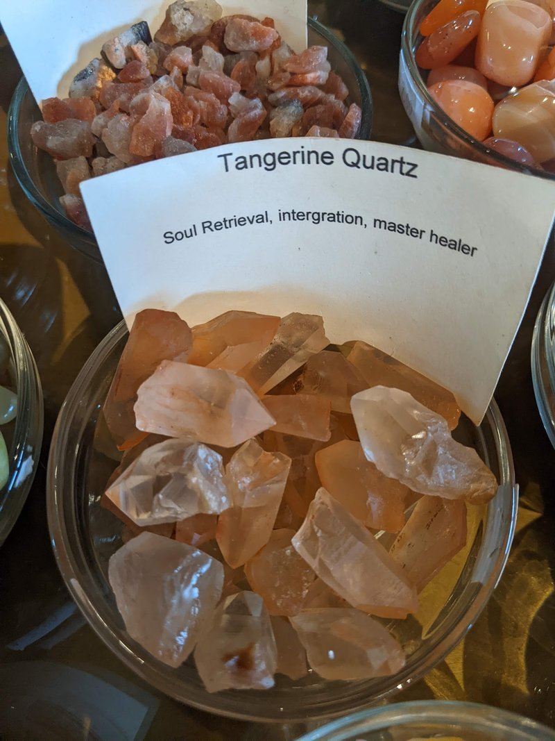 Selection of healing crystals, tumbled stones, and decorative mineral pieces