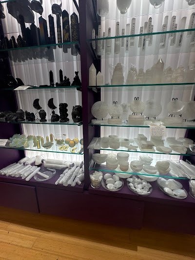 Organized crystal display with labeled stones and healing minerals