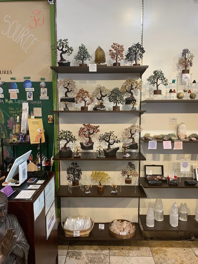 Organized crystal display with labeled stones and healing minerals