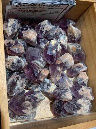 Crystal and mineral specimens including quartz, amethyst, and calcite varieties