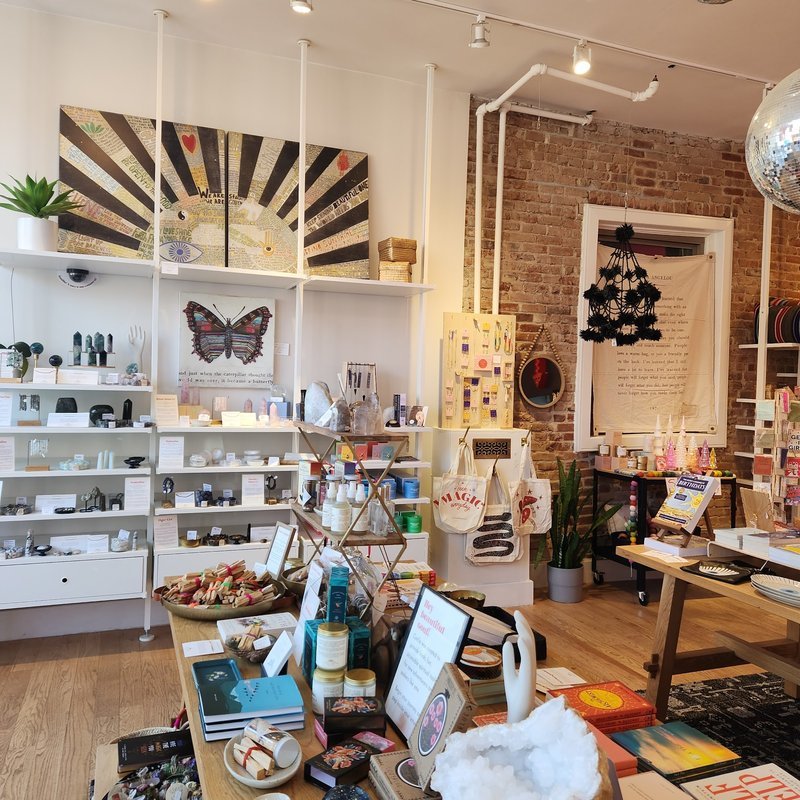 Shop interior featuring gemstones, healing crystals, and spiritual products