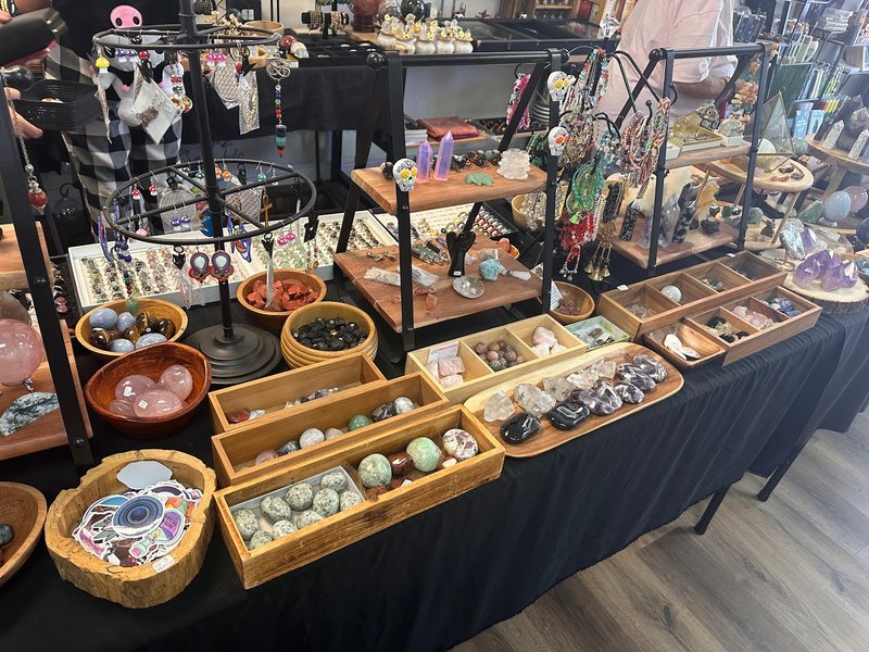 Display of polished crystal specimens, geodes, and mineral towers