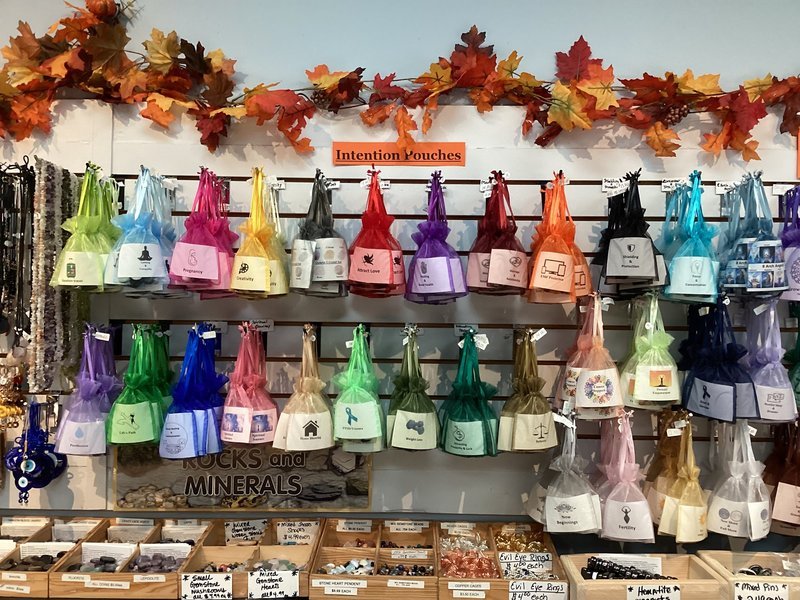 Collection of tumbled stones, raw minerals, and crystal clusters