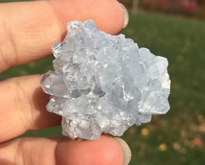 Variety of gemstones, crystal carvings, and polished mineral specimens