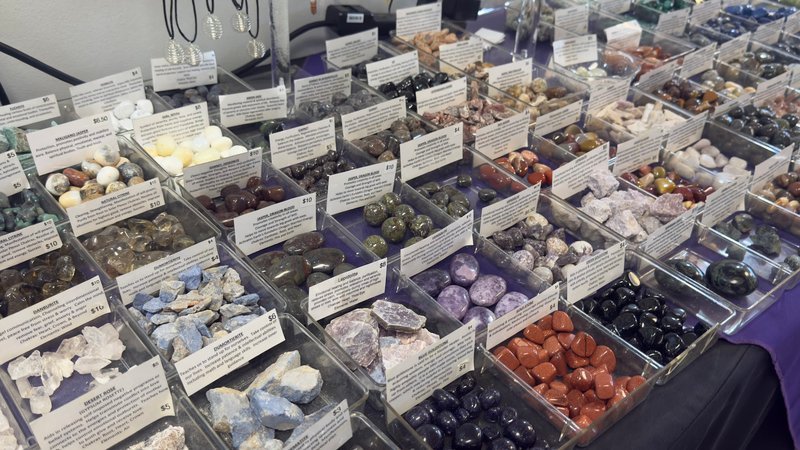 Organized crystal display with labeled stones and healing minerals