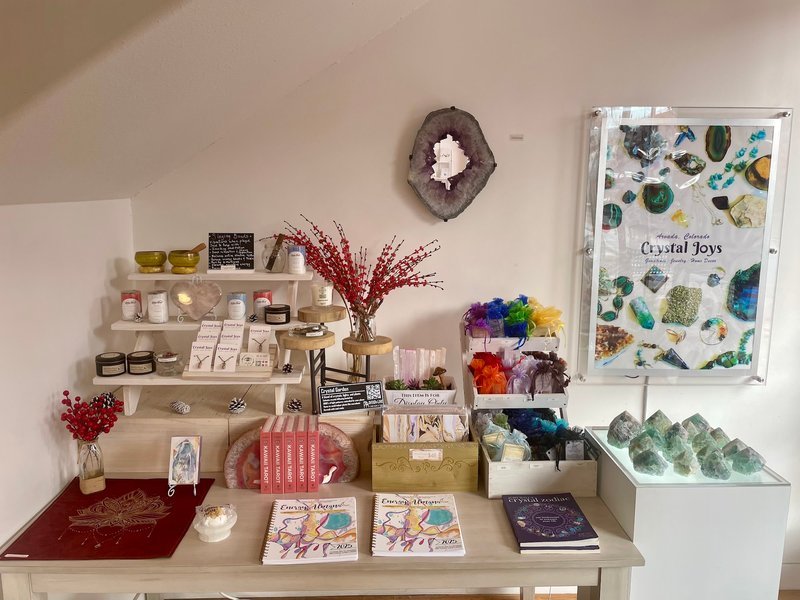 Shop interior featuring gemstones, healing crystals, and spiritual products