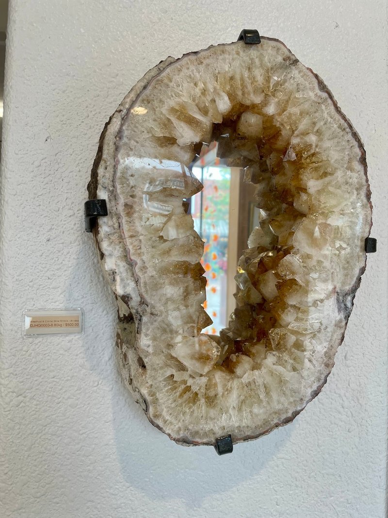 Collection of tumbled stones, raw minerals, and crystal clusters