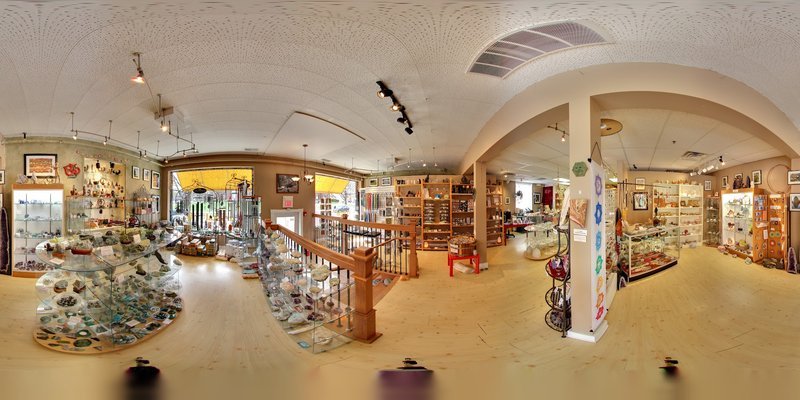 Display featuring crystal points, polished stones, and raw mineral specimens