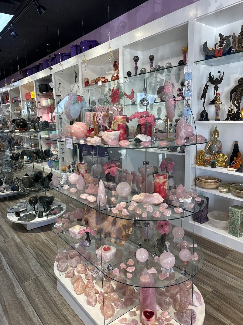 Collection of tumbled stones, raw minerals, and crystal clusters