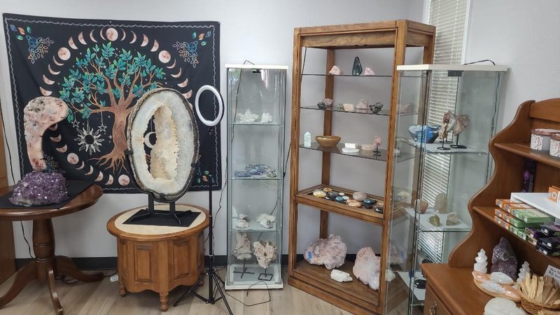 Organized crystal display with labeled stones and healing minerals