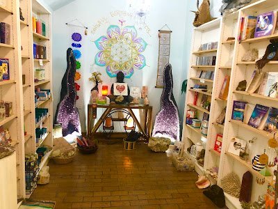 Organized crystal display with labeled stones and healing minerals