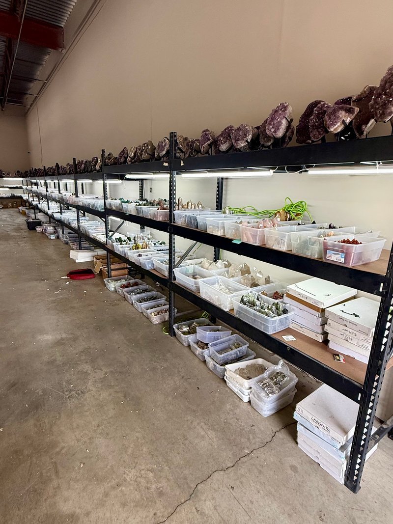 Display of polished crystal specimens, geodes, and mineral towers