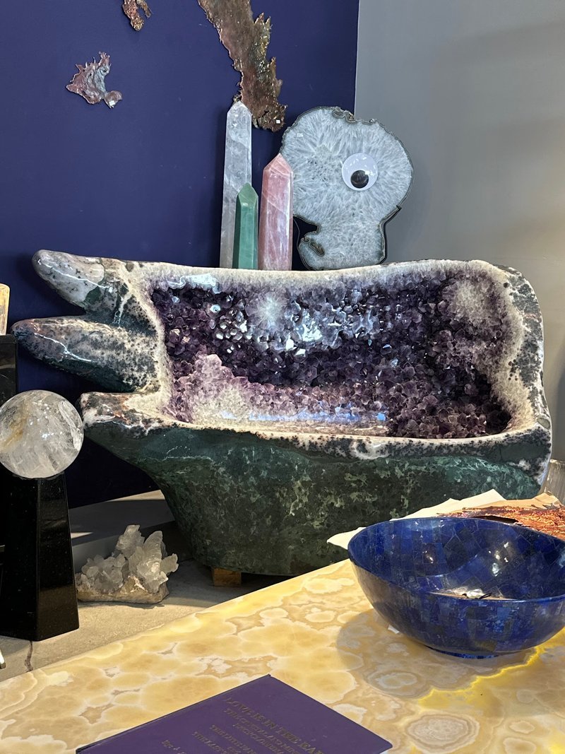 Collection of tumbled stones, raw minerals, and crystal clusters