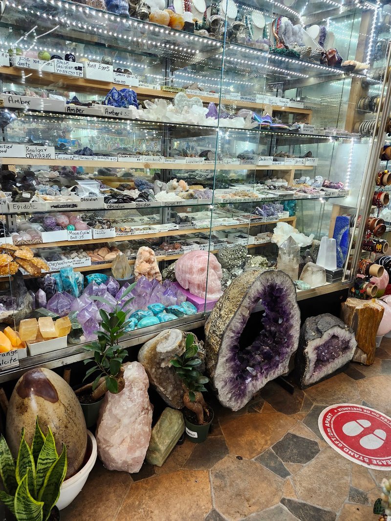 Retail display with tumbled stones, raw crystals, and polished specimens