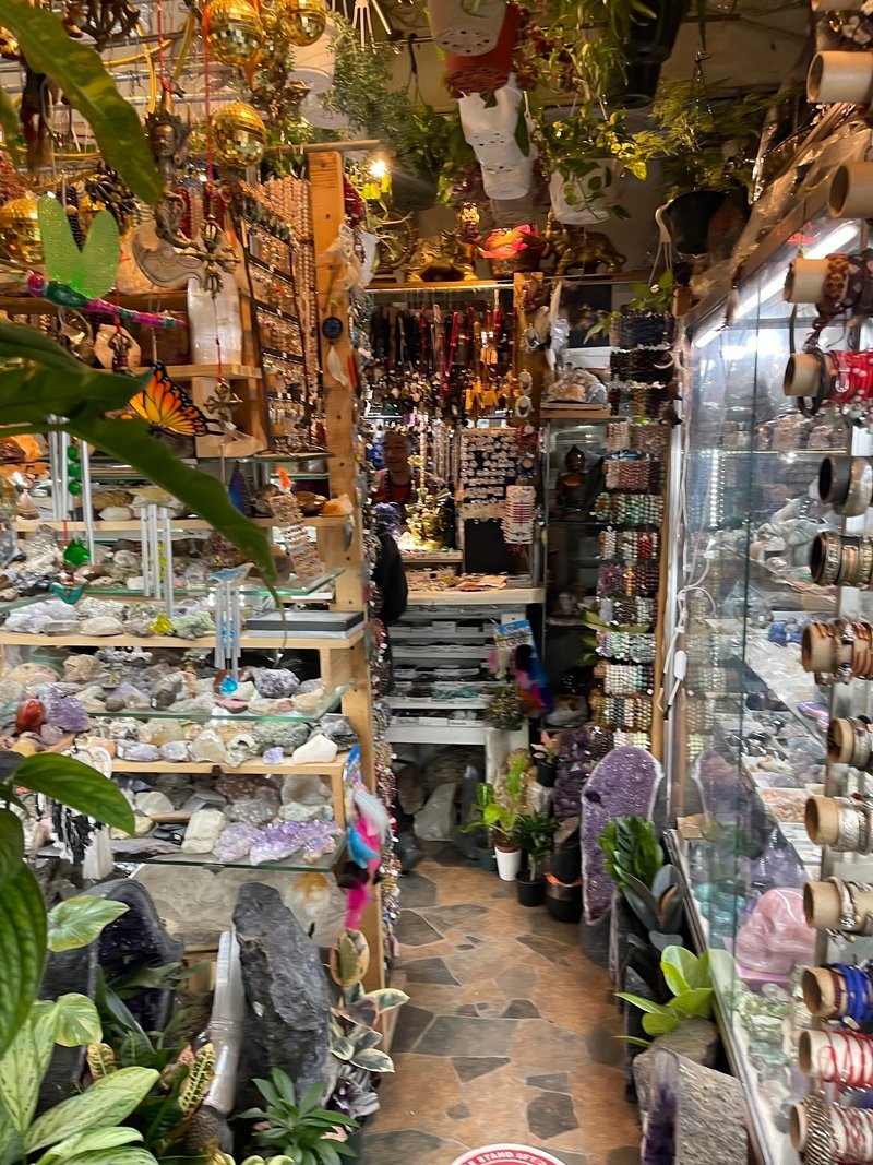 Display of polished crystal specimens, geodes, and mineral towers