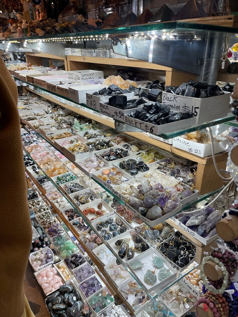 Selection of healing crystals, tumbled stones, and decorative mineral pieces