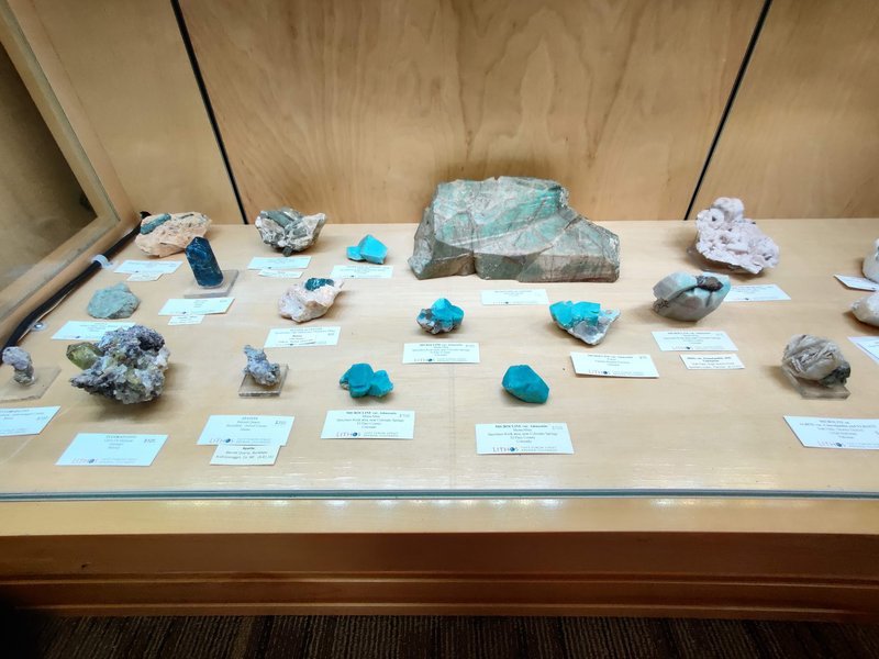 Retail shelving with organized crystals, stones, and spiritual products