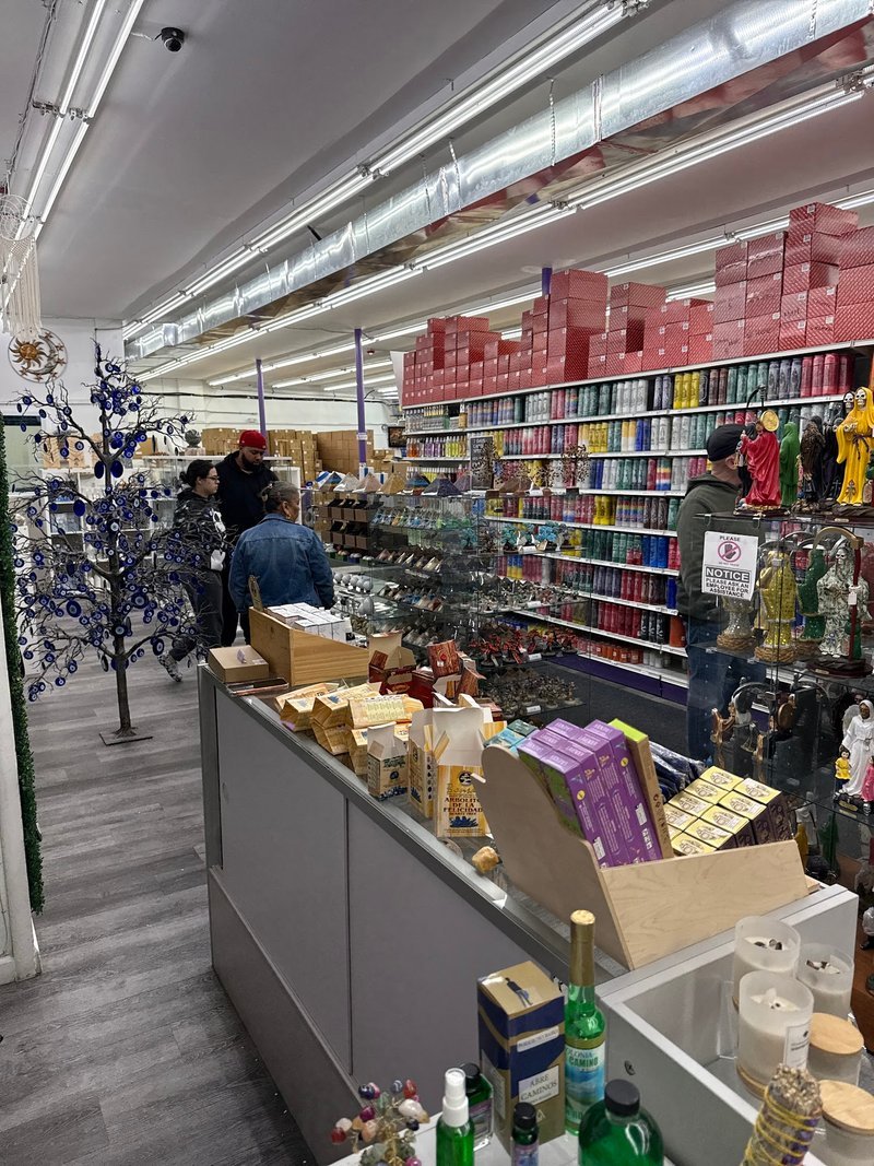 Display featuring crystal points, polished stones, and raw mineral specimens