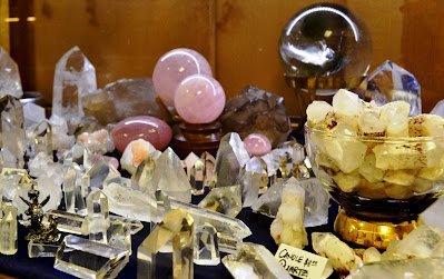 Display of polished crystal specimens, geodes, and mineral towers
