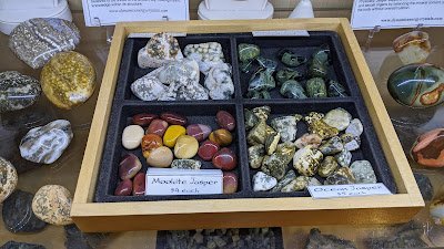 Crystal and mineral specimens including quartz, amethyst, and calcite varieties