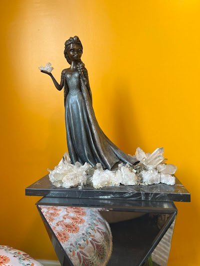 Display of polished crystal specimens, geodes, and mineral towers