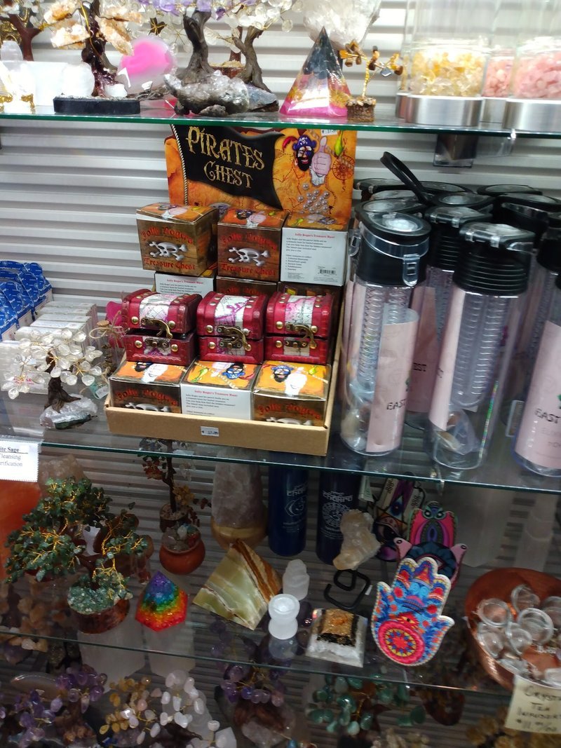 Collection of tumbled stones, raw minerals, and crystal clusters