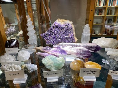 Selection of healing crystals, tumbled stones, and decorative mineral pieces