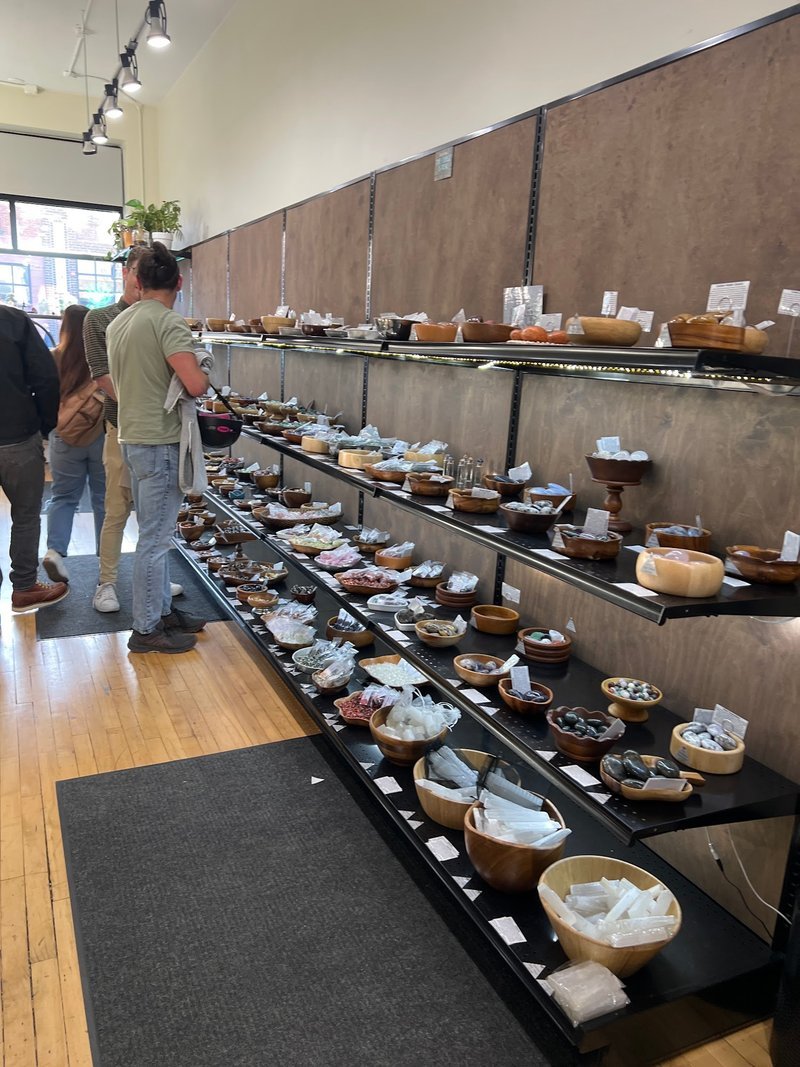Organized crystal display with labeled stones and healing minerals
