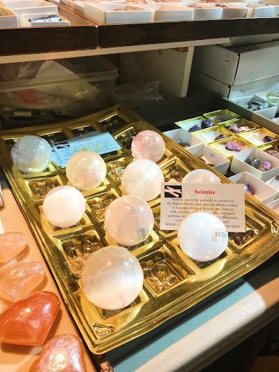 Crystal and mineral specimens including quartz, amethyst, and calcite varieties