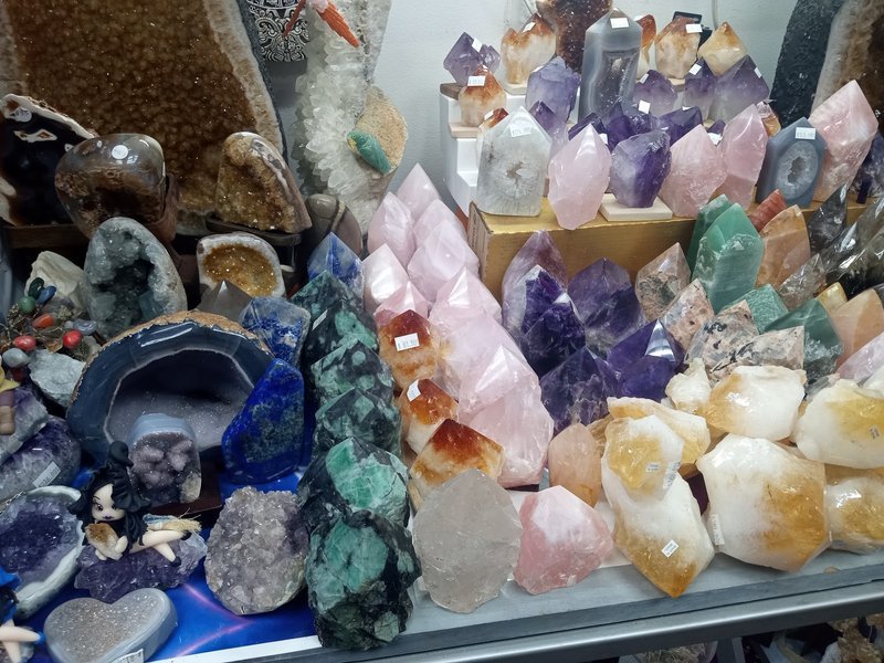 Organized crystal display with labeled stones and healing minerals