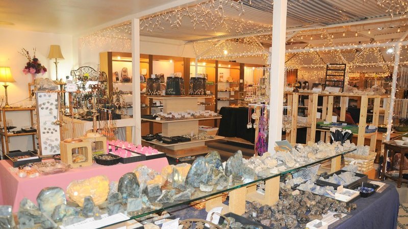 Shop interior featuring gemstones, healing crystals, and spiritual products