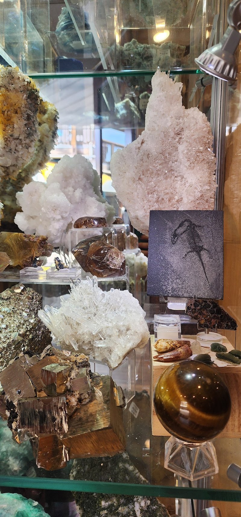 Retail shelving with organized crystals, stones, and spiritual products