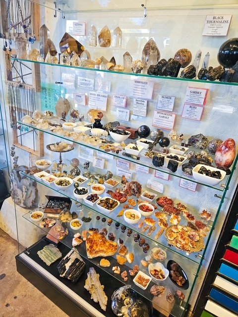 Shop interior featuring gemstones, healing crystals, and spiritual products