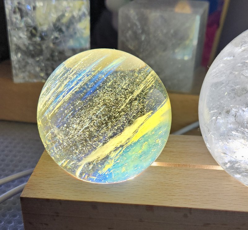 Display featuring crystal points, polished stones, and raw mineral specimens