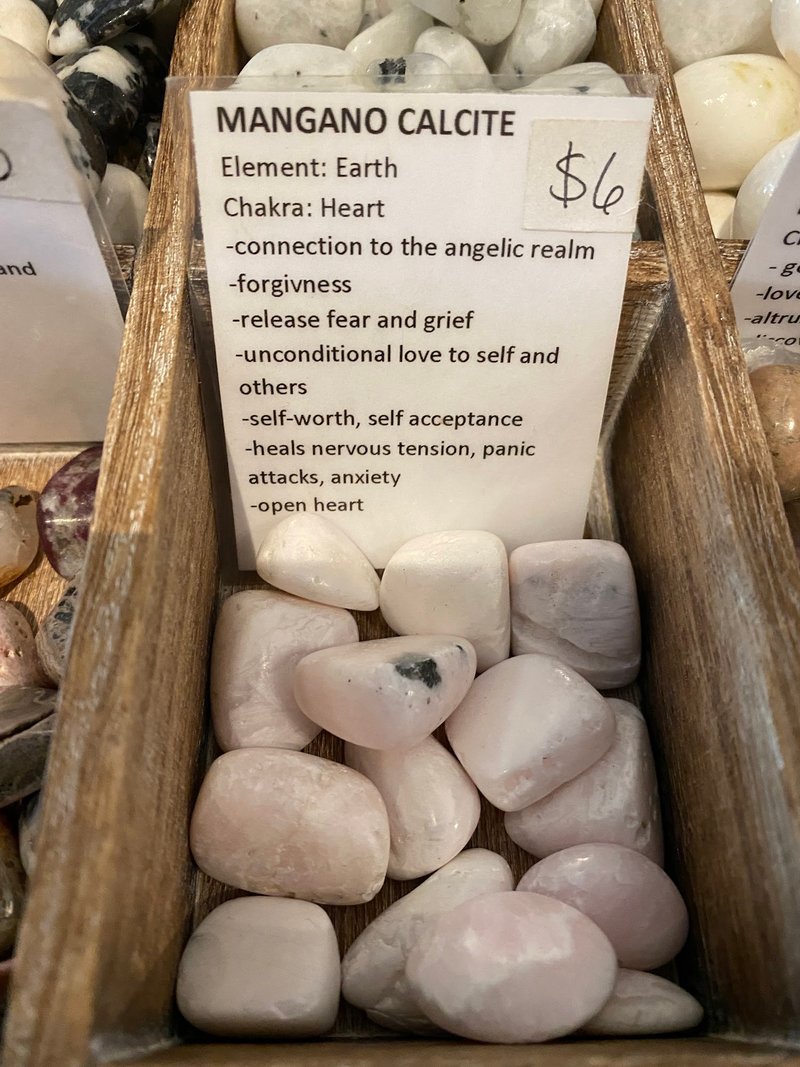 Selection of healing crystals, tumbled stones, and decorative mineral pieces